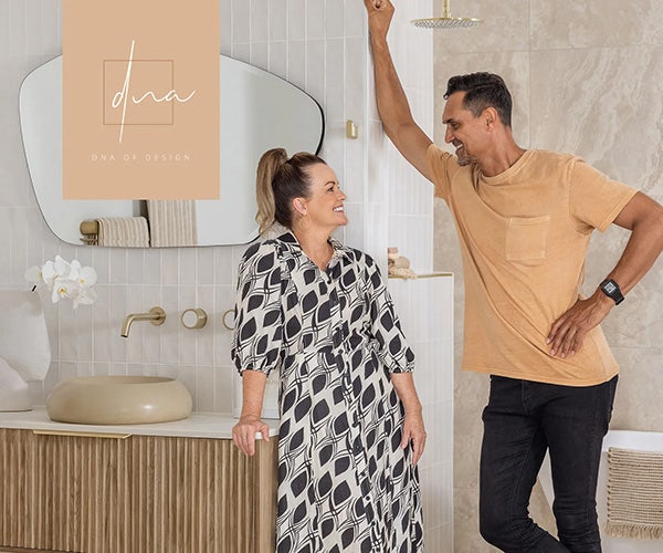 Deb and Andy share smiles in the beautifully designed bathroom of their 极速赛车官网168 Tiles-adorned house